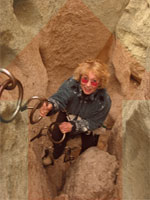 climbing out of hole in the wall